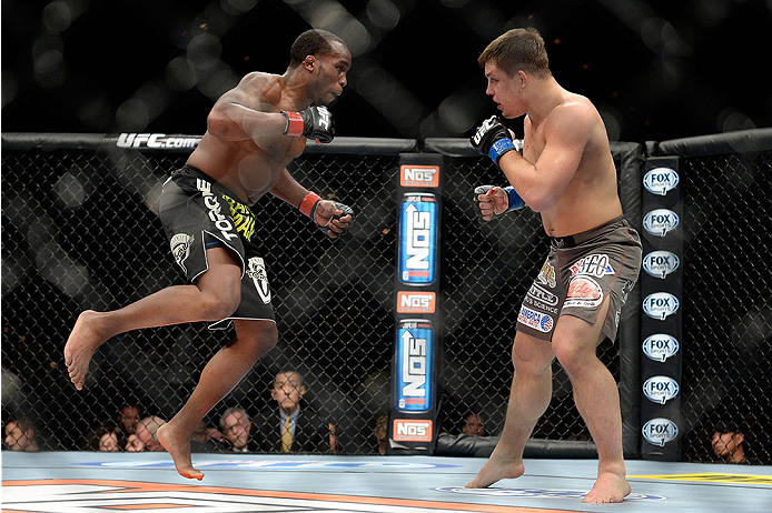 LAS VEGAS, NV - NOVEMBER 30:  (L-R) Sean Spencer jumps at Drew Dober in their welterweight fight during The Ultimate Fighter season 18 live finale inside the Mandalay Bay Events Center on November 30, 2013 in Las Vegas, Nevada. (Photo by Jeff Bottari/Zuff