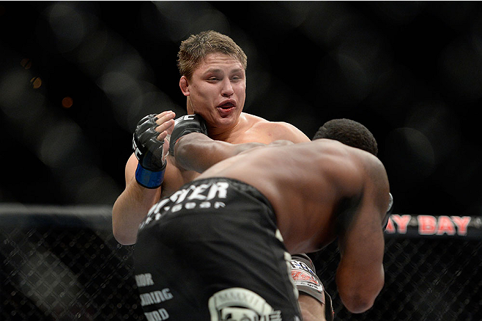 LAS VEGAS, NV - NOVEMBER 30:  (R-L) Sean Spencer punches Drew Dober in their welterweight fight during The Ultimate Fighter season 18 live finale inside the Mandalay Bay Events Center on November 30, 2013 in Las Vegas, Nevada. (Photo by Jeff Bottari/Zuffa