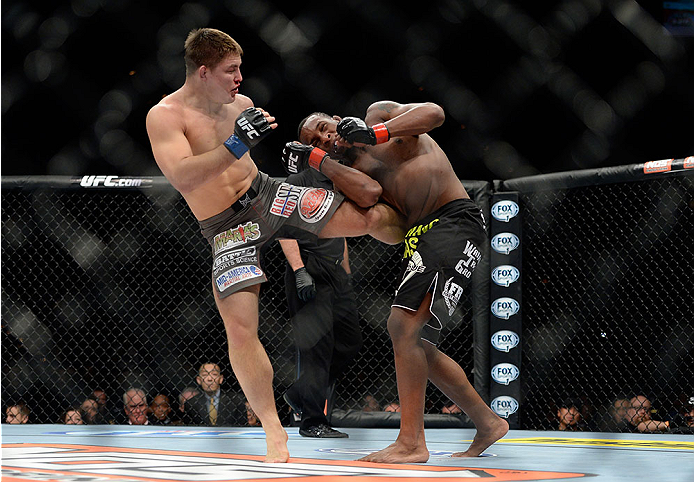 LAS VEGAS, NV - NOVEMBER 30:  (L-R) Drew Dober kicks Sean Spencer in their welterweight fight during The Ultimate Fighter season 18 live finale inside the Mandalay Bay Events Center on November 30, 2013 in Las Vegas, Nevada. (Photo by Jeff Bottari/Zuffa L