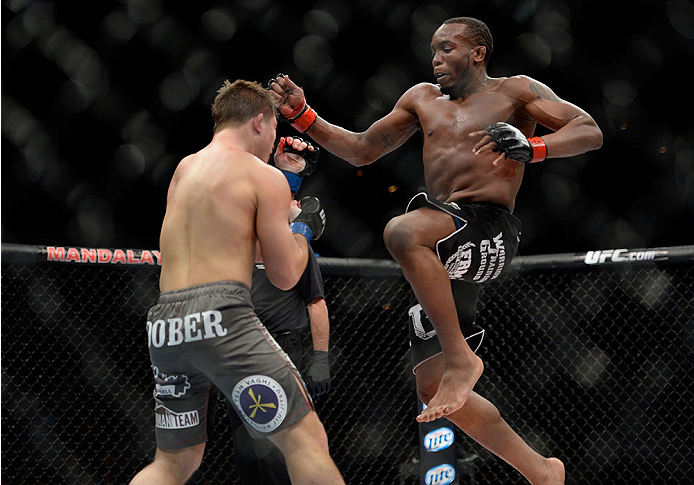 LAS VEGAS, NV - NOVEMBER 30:  (R-L) Sean Spencer jumps at Drew Dober in their welterweight fight during The Ultimate Fighter season 18 live finale inside the Mandalay Bay Events Center on November 30, 2013 in Las Vegas, Nevada. (Photo by Jeff Bottari/Zuff