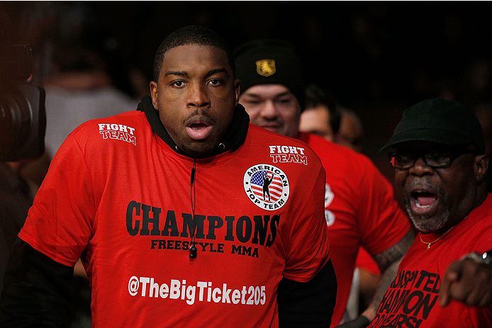 LAS VEGAS, NV - NOVEMBER 30: Walt Harris walks into the arena before his fight against Jared Rosholt in their heavyweight fight during The Ultimate Fighter season 18 live finale inside the Mandalay Bay Events Center on November 30, 2013 in Las Vegas, Nev