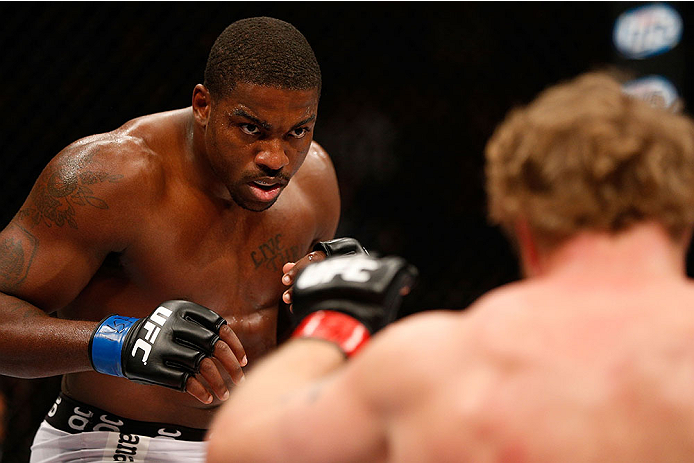 LAS VEGAS, NV - NOVEMBER 30:  (L-R) Walt Harris looks to strike Jared Rosholt in their heavyweight fight during The Ultimate Fighter season 18 live finale inside the Mandalay Bay Events Center on November 30, 2013 in Las Vegas, Nevada. (Photo by Josh Hedg