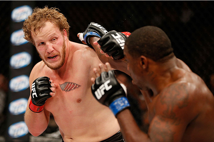 LAS VEGAS, NV - NOVEMBER 30:  (L-R) Jared Rosholt and Walt Harris exchange punches in their heavyweight fight during The Ultimate Fighter season 18 live finale inside the Mandalay Bay Events Center on November 30, 2013 in Las Vegas, Nevada. (Photo by Josh