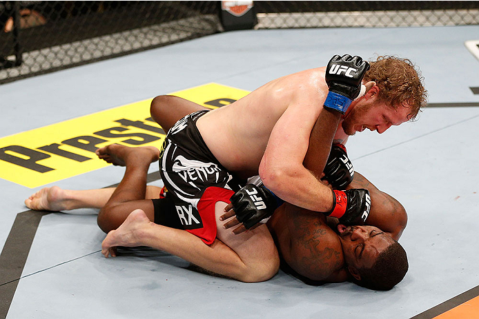 LAS VEGAS, NV - NOVEMBER 30:  Jared Rosholt (black shorts) controls Walt Harris in their heavyweight fight during The Ultimate Fighter season 18 live finale inside the Mandalay Bay Events Center on November 30, 2013 in Las Vegas, Nevada. (Photo by Josh He