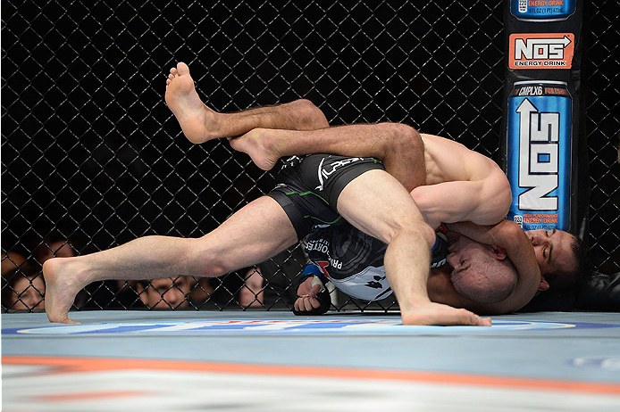 LAS VEGAS, NV - NOVEMBER 30:  Tom Niinimaki (black shorts) is controlled by Rani Yahya in their featherweight fight during The Ultimate Fighter season 18 live finale inside the Mandalay Bay Events Center on November 30, 2013 in Las Vegas, Nevada. (Photo b