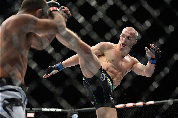 LAS VEGAS, NV - NOVEMBER 30:  (R-L) Tom Niinimaki kicks Rani Yahya in their featherweight fight during The Ultimate Fighter season 18 live finale inside the Mandalay Bay Events Center on November 30, 2013 in Las Vegas, Nevada. (Photo by Jeff Bottari/Zuffa