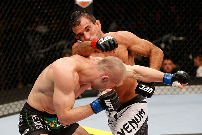 LAS VEGAS, NV - NOVEMBER 30: (R-L) Rani Yahya punches Tom Niinimaki in their featherweight fight during The Ultimate Fighter season 18 live finale inside the Mandalay Bay Events Center on November 30, 2013 in Las Vegas, Nevada. (Photo by Josh Hedges/Zuff