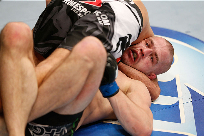 LAS VEGAS, NV - NOVEMBER 30: (R-L) Tom Niinimaki is controlled by Rani Yahya in their featherweight fight during The Ultimate Fighter season 18 live finale inside the Mandalay Bay Events Center on November 30, 2013 in Las Vegas, Nevada. (Photo by Josh He