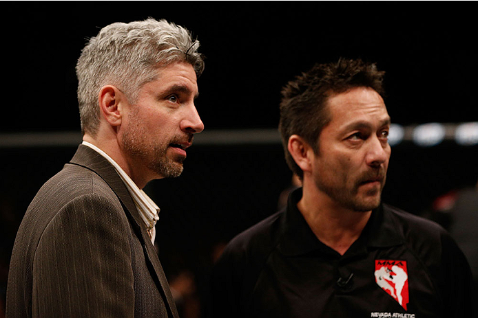 LAS VEGAS, NV - NOVEMBER 30: (L-R) Executive Director of the Nevada State Athletic Commission Keith Kizer and referee Mario Yamasaki discuss the stoppage between Maximo Blanco and Akira Corassani in their featherweight fight during The Ultimate Fighter s