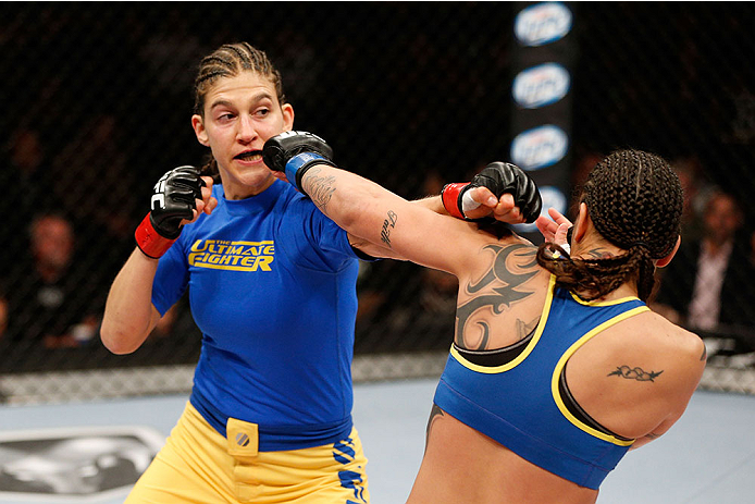 LAS VEGAS, NV - NOVEMBER 30:  (L-R) Roxanne Modafferi punches Raquel Pennington in their women's bantamweight fight during The Ultimate Fighter season 18 live finale inside the Mandalay Bay Events Center on November 30, 2013 in Las Vegas, Nevada. (Photo b