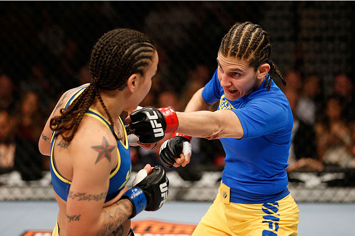 LAS VEGAS, NV - NOVEMBER 30:  (R-L) Roxanne Modafferi punches Raquel Pennington in their women's bantamweight fight during The Ultimate Fighter season 18 live finale inside the Mandalay Bay Events Center on November 30, 2013 in Las Vegas, Nevada. (Photo b