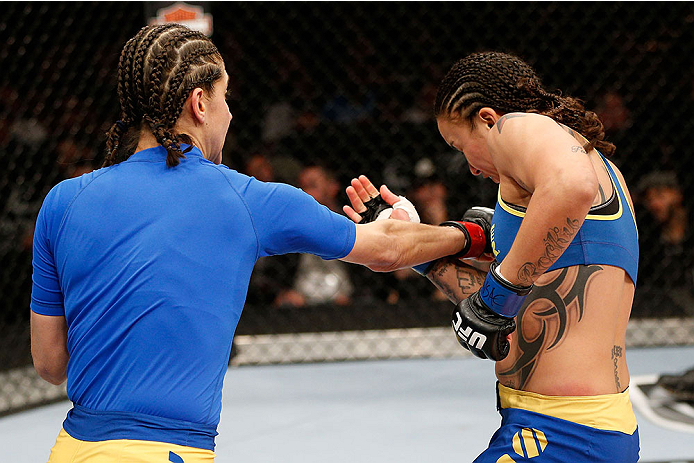 LAS VEGAS, NV - NOVEMBER 30:  (L-R) Roxanne Modafferi punches Raquel Pennington in their women's bantamweight fight during The Ultimate Fighter season 18 live finale inside the Mandalay Bay Events Center on November 30, 2013 in Las Vegas, Nevada. (Photo b