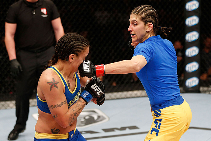 LAS VEGAS, NV - NOVEMBER 30: (R-L) Roxanne Modafferi punches Raquel Pennington in their women's bantamweight fight during The Ultimate Fighter season 18 live finale inside the Mandalay Bay Events Center on November 30, 2013 in Las Vegas, Nevada. (Photo b