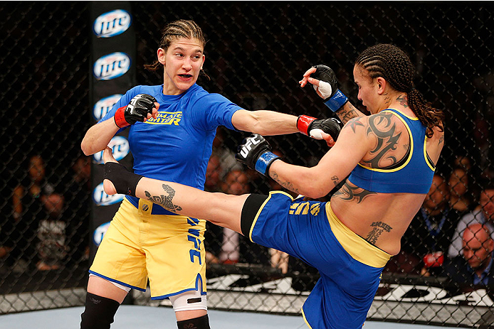 LAS VEGAS, NV - NOVEMBER 30:  (L-R) Roxanne Modafferi punches Raquel Pennington in their women's bantamweight fight during The Ultimate Fighter season 18 live finale inside the Mandalay Bay Events Center on November 30, 2013 in Las Vegas, Nevada. (Photo b