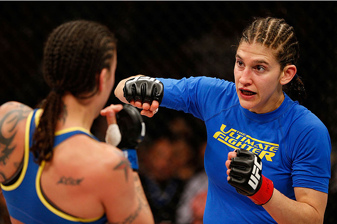 LAS VEGAS, NV - NOVEMBER 30:  (R-L) Roxanne Modafferi punches Raquel Pennington in their women's bantamweight fight during The Ultimate Fighter season 18 live finale inside the Mandalay Bay Events Center on November 30, 2013 in Las Vegas, Nevada. (Photo b