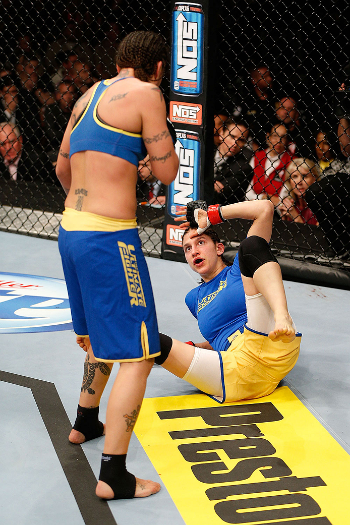 LAS VEGAS, NV - NOVEMBER 30: (L-R) Raquel Pennington looks to strike Roxanne Modafferi in their women's bantamweight fight during The Ultimate Fighter season 18 live finale inside the Mandalay Bay Events Center on November 30, 2013 in Las Vegas, Nevada.