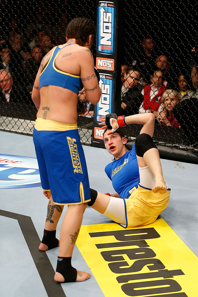 LAS VEGAS, NV - NOVEMBER 30:  (L-R) Raquel Pennington looks to strike Roxanne Modafferi in their women's bantamweight fight during The Ultimate Fighter season 18 live finale inside the Mandalay Bay Events Center on November 30, 2013 in Las Vegas, Nevada. 