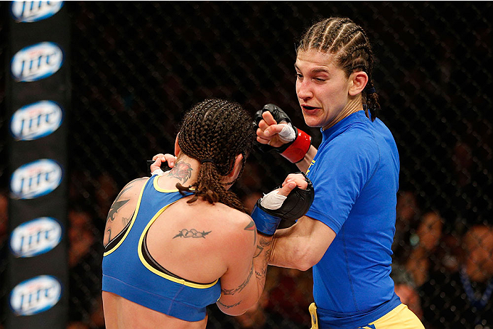 LAS VEGAS, NV - NOVEMBER 30: (R-L) Roxanne Modafferi punches Raquel Pennington in their women's bantamweight fight during The Ultimate Fighter season 18 live finale inside the Mandalay Bay Events Center on November 30, 2013 in Las Vegas, Nevada. (Photo b