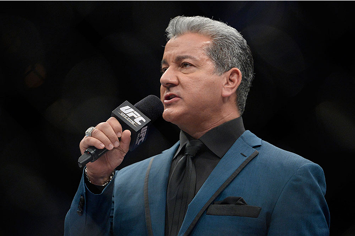 LAS VEGAS, NV - NOVEMBER 30: UFC Octagon announcer Bruce Buffer introduces Raquel Pennington and Roxanne Modafferi before their women's bantamweight fight during The Ultimate Fighter season 18 live finale inside the Mandalay Bay Events Center on November