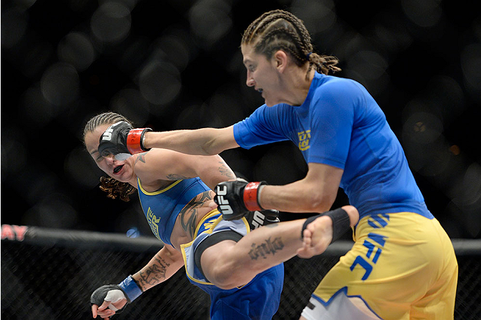 LAS VEGAS, NV - NOVEMBER 30:  (L-R) Raquel Pennington kicks Roxanne Modafferi in their women's bantamweight fight during The Ultimate Fighter season 18 live finale inside the Mandalay Bay Events Center on November 30, 2013 in Las Vegas, Nevada. (Photo by 