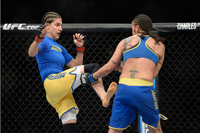 LAS VEGAS, NV - NOVEMBER 30:  (L-R) Roxanne Modafferi kicks Raquel Pennington in their women's bantamweight fight during The Ultimate Fighter season 18 live finale inside the Mandalay Bay Events Center on November 30, 2013 in Las Vegas, Nevada. (Photo by 