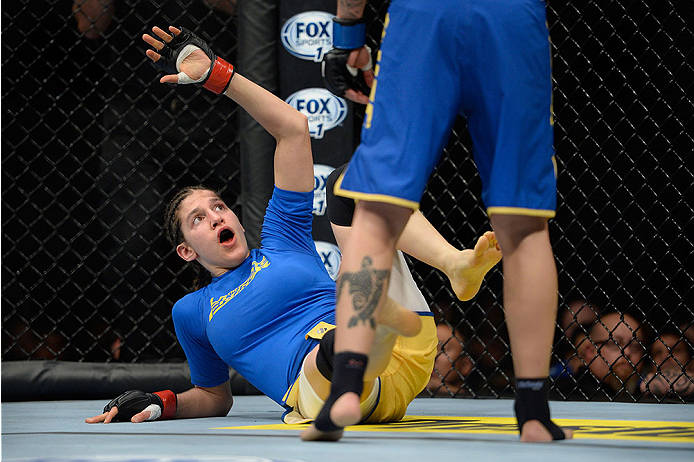 LAS VEGAS, NV - NOVEMBER 30: (L-R) Roxanne Modafferi looks to block an attack from Raquel Pennington in their women's bantamweight fight during The Ultimate Fighter season 18 live finale inside the Mandalay Bay Events Center on November 30, 2013 in Las V