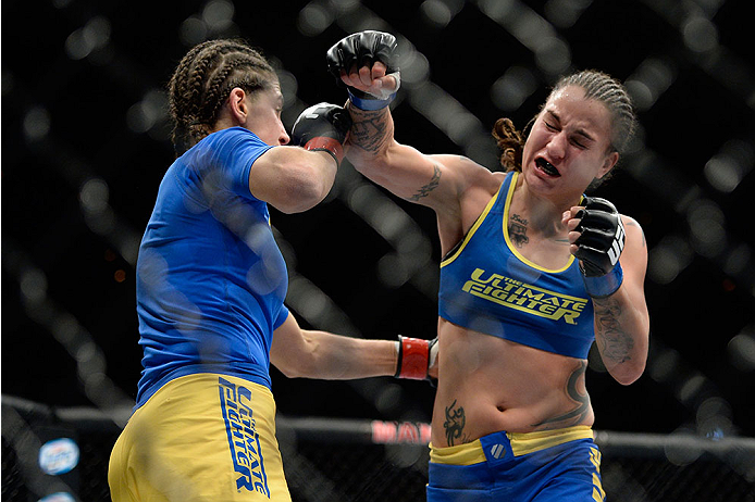 LAS VEGAS, NV - NOVEMBER 30: (R-L) Raquel Pennington misses on a punch against Roxanne Modafferi in their women's bantamweight fight during The Ultimate Fighter season 18 live finale inside the Mandalay Bay Events Center on November 30, 2013 in Las Vegas