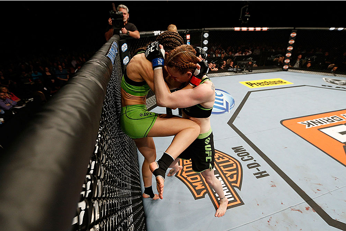 LAS VEGAS, NV - NOVEMBER 30:  (L-R) Jessamyn Duke lands a knee to the body Peggy Morgan in their women's bantamweight fight during The Ultimate Fighter season 18 live finale inside the Mandalay Bay Events Center on November 30, 2013 in Las Vegas, Nevada. 