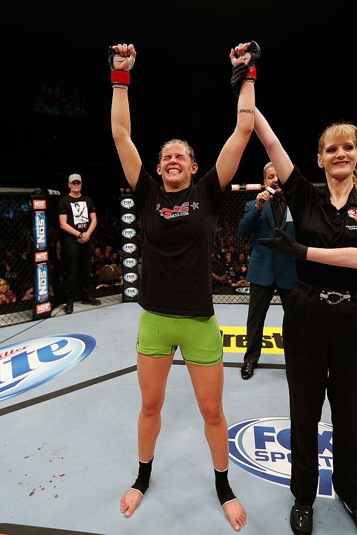 LAS VEGAS, NV - NOVEMBER 30: Jessamyn Duke celebrates after defeating Peggy Morgan in their women's bantamweight fight during The Ultimate Fighter season 18 live finale inside the Mandalay Bay Events Center on November 30, 2013 in Las Vegas, Nevada. (Pho