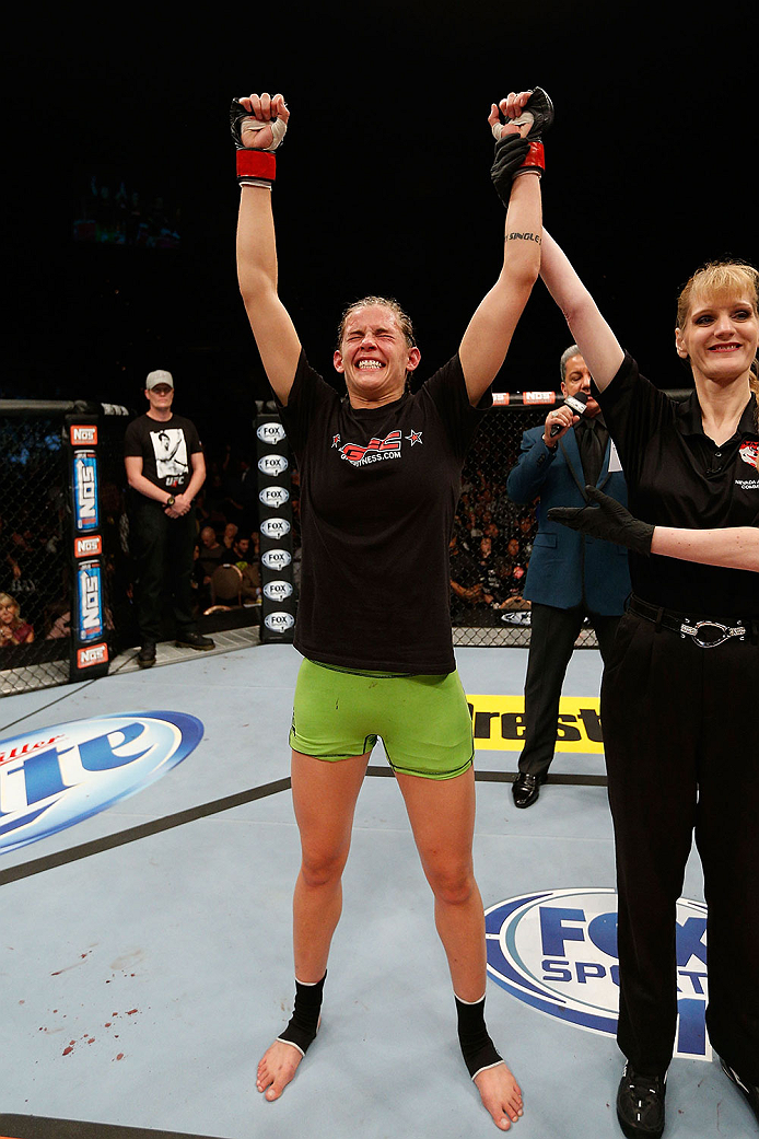 LAS VEGAS, NV - NOVEMBER 30:  Jessamyn Duke celebrates after defeating Peggy Morgan in their women's bantamweight fight during The Ultimate Fighter season 18 live finale inside the Mandalay Bay Events Center on November 30, 2013 in Las Vegas, Nevada. (Pho