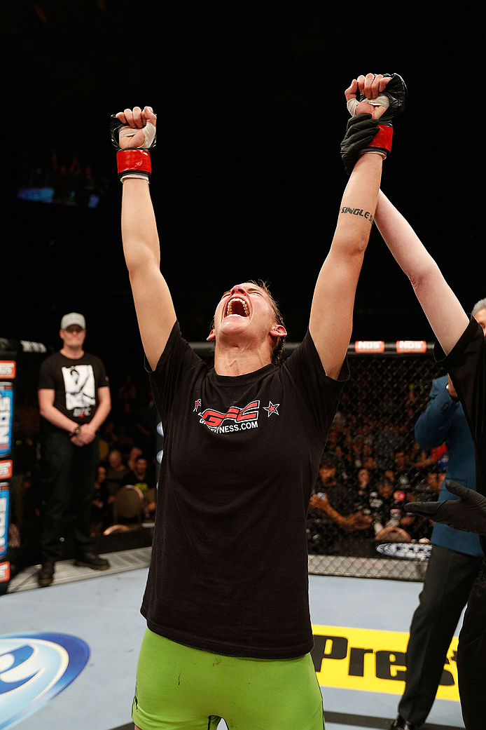 LAS VEGAS, NV - NOVEMBER 30: Jessamyn Duke celebrates after defeating Peggy Morgan in their women's bantamweight fight during The Ultimate Fighter season 18 live finale inside the Mandalay Bay Events Center on November 30, 2013 in Las Vegas, Nevada. (Pho
