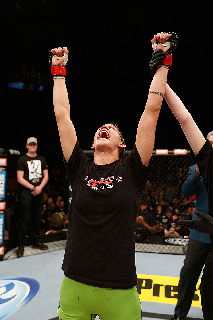 LAS VEGAS, NV - NOVEMBER 30:  Jessamyn Duke celebrates after defeating Peggy Morgan in their women's bantamweight fight during The Ultimate Fighter season 18 live finale inside the Mandalay Bay Events Center on November 30, 2013 in Las Vegas, Nevada. (Pho