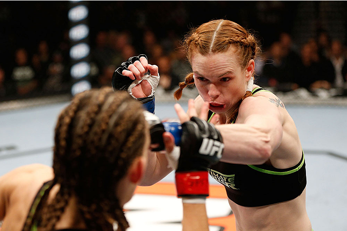 LAS VEGAS, NV - NOVEMBER 30:  (R-L) Peggy Morgan punches Jessamyn Duke in their women's bantamweight fight during The Ultimate Fighter season 18 live finale inside the Mandalay Bay Events Center on November 30, 2013 in Las Vegas, Nevada. (Photo by Josh He