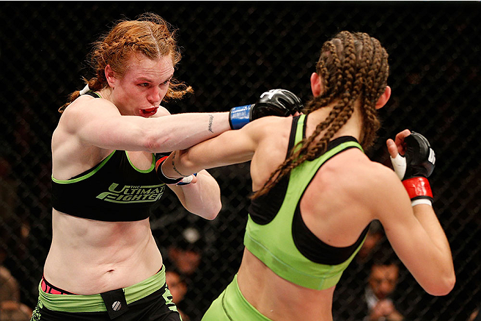 LAS VEGAS, NV - NOVEMBER 30:  (L-R) Peggy Morgan punches Jessamyn Duke in their women's bantamweight fight during The Ultimate Fighter season 18 live finale inside the Mandalay Bay Events Center on November 30, 2013 in Las Vegas, Nevada. (Photo by Josh He