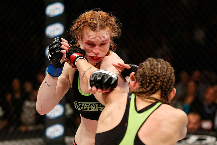 LAS VEGAS, NV - NOVEMBER 30:  (R-L) Jessamyn Duke punches Peggy Morgan in their women's bantamweight fight during The Ultimate Fighter season 18 live finale inside the Mandalay Bay Events Center on November 30, 2013 in Las Vegas, Nevada. (Photo by Josh He