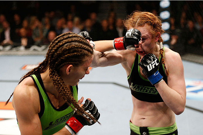 LAS VEGAS, NV - NOVEMBER 30:  (L-R) Jessamyn Duke punches Peggy Morgan in their women's bantamweight fight during The Ultimate Fighter season 18 live finale inside the Mandalay Bay Events Center on November 30, 2013 in Las Vegas, Nevada. (Photo by Josh He