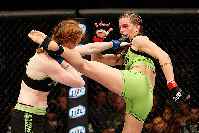 LAS VEGAS, NV - NOVEMBER 30:  (R-L) Jessamyn Duke kicks Peggy Morgan in their women's bantamweight fight during The Ultimate Fighter season 18 live finale inside the Mandalay Bay Events Center on November 30, 2013 in Las Vegas, Nevada. (Photo by Josh Hedg