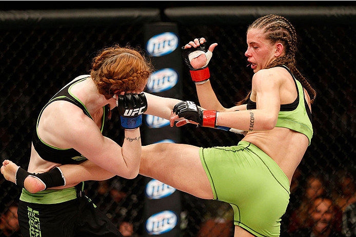 LAS VEGAS, NV - NOVEMBER 30:  (R-L) Jessamyn Duke kicks Peggy Morgan in their women's bantamweight fight during The Ultimate Fighter season 18 live finale inside the Mandalay Bay Events Center on November 30, 2013 in Las Vegas, Nevada. (Photo by Josh Hedg