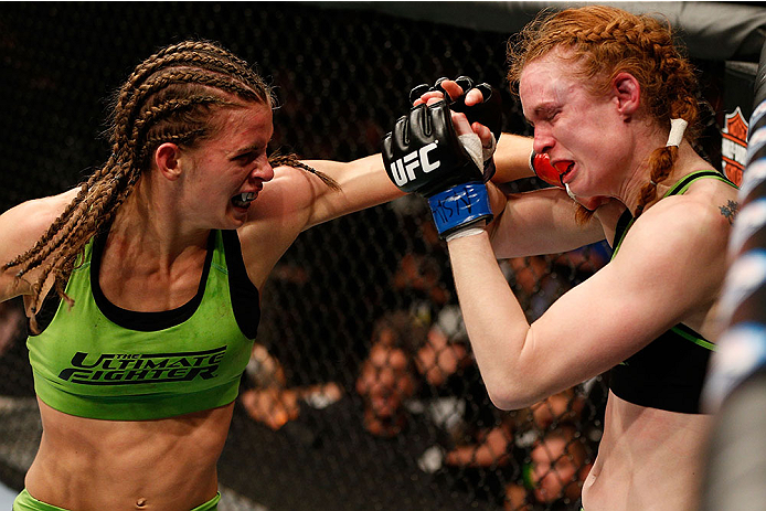 LAS VEGAS, NV - NOVEMBER 30:  (L-R) Jessamyn Duke punches Peggy Morgan in their women's bantamweight fight during The Ultimate Fighter season 18 live finale inside the Mandalay Bay Events Center on November 30, 2013 in Las Vegas, Nevada. (Photo by Josh He