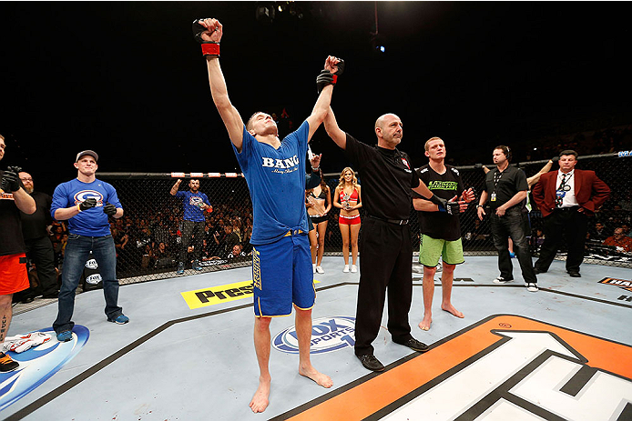 LAS VEGAS, NV - NOVEMBER 30: Chris Holdsworth (L) celebrates after defeating David Grant in their bantamweight final fight during The Ultimate Fighter season 18 live finale inside the Mandalay Bay Events Center on November 30, 2013 in Las Vegas, Nevada.