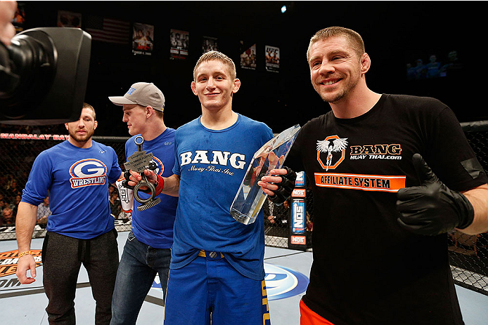 LAS VEGAS, NV - NOVEMBER 30: Chris Holdsworth celebrates with his corner after defeating David Grant in their bantamweight final fight during The Ultimate Fighter season 18 live finale inside the Mandalay Bay Events Center on November 30, 2013 in Las Veg
