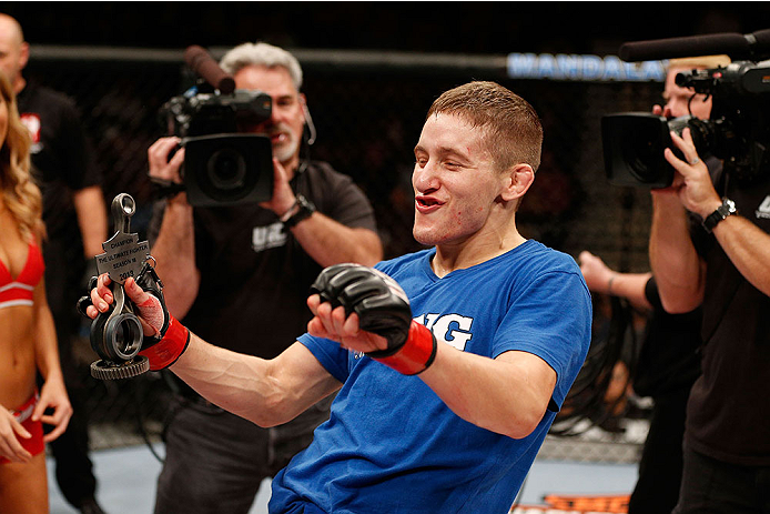 LAS VEGAS, NV - NOVEMBER 30: Chris Holdsworth celebrates after defeating David Grant in their bantamweight final fight during The Ultimate Fighter season 18 live finale inside the Mandalay Bay Events Center on November 30, 2013 in Las Vegas, Nevada. (Pho