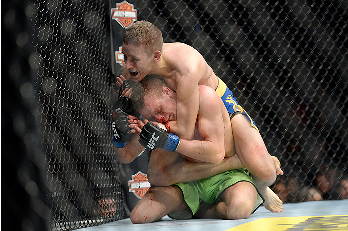 LAS VEGAS, NV - NOVEMBER 30:  Chris Holdsworth submits David Grant in their bantamweight final fight during The Ultimate Fighter season 18 live finale inside the Mandalay Bay Events Center on November 30, 2013 in Las Vegas, Nevada. (Photo by Jeff Bottari/