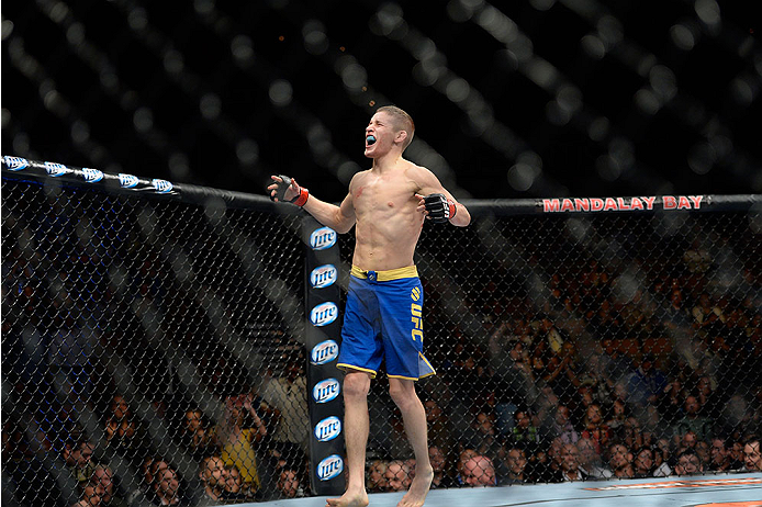 LAS VEGAS, NV - NOVEMBER 30: Chris Holdsworth celebrates after defeating David Grant in their bantamweight final fight during The Ultimate Fighter season 18 live finale inside the Mandalay Bay Events Center on November 30, 2013 in Las Vegas, Nevada. (Pho