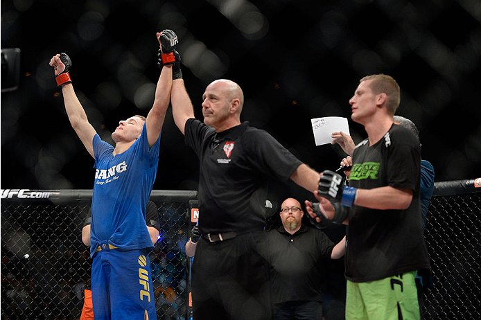 LAS VEGAS, NV - NOVEMBER 30: (L-R) Chris Holdsworth celebrates after defeating David Grant in their bantamweight final fight during The Ultimate Fighter season 18 live finale inside the Mandalay Bay Events Center on November 30, 2013 in Las Vegas, Nevada