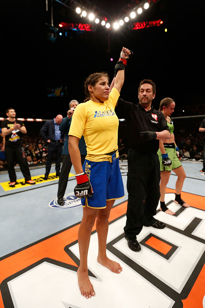 LAS VEGAS, NV - NOVEMBER 30: Julianna Pena celebrates after defeating Jessica Rakoczy in their women's bantamweight final fight during The Ultimate Fighter season 18 live finale inside the Mandalay Bay Events Center on November 30, 2013 in Las Vegas, Nev