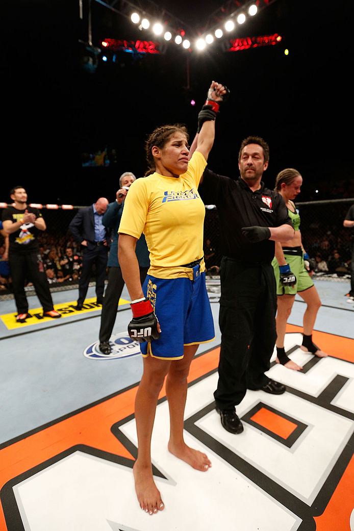 LAS VEGAS, NV - NOVEMBER 30:  Julianna Pena celebrates after defeating Jessica Rakoczy in their women's bantamweight final fight during The Ultimate Fighter season 18 live finale inside the Mandalay Bay Events Center on November 30, 2013 in Las Vegas, Nev