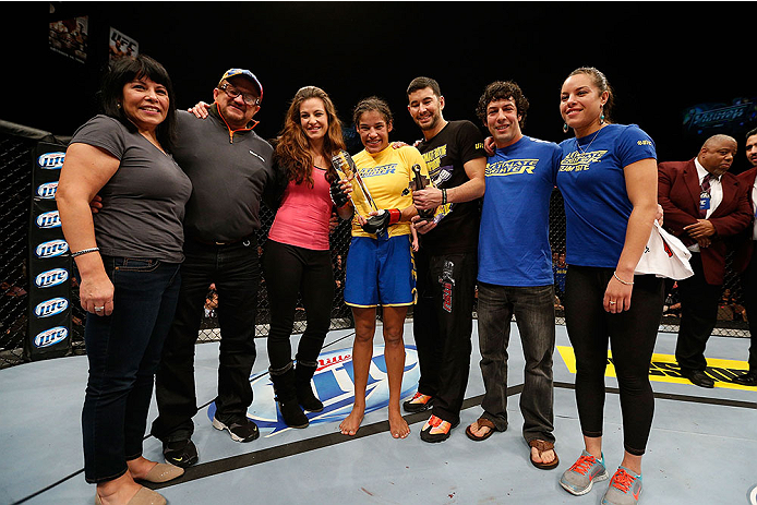 LAS VEGAS, NV - NOVEMBER 30:  Julianna Pena celebrates with her family and corner including Miesha Tate after defeating Jessica Rakoczy in their women's bantamweight final fight during The Ultimate Fighter season 18 live finale inside the Mandalay Bay Eve