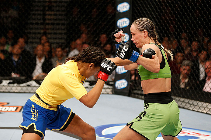 LAS VEGAS, NV - NOVEMBER 30: (R-L) Jessica Rakoczy punches Julianna Pena in their women's bantamweight final fight during The Ultimate Fighter season 18 live finale inside the Mandalay Bay Events Center on November 30, 2013 in Las Vegas, Nevada. (Photo b