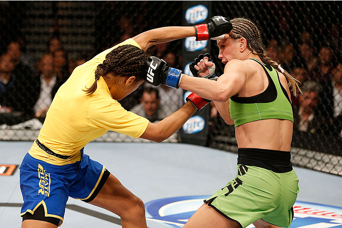 LAS VEGAS, NV - NOVEMBER 30:  (L-R) Julianna Pena punches Jessica Rakoczy in their women's bantamweight final fight during The Ultimate Fighter season 18 live finale inside the Mandalay Bay Events Center on November 30, 2013 in Las Vegas, Nevada. (Photo b